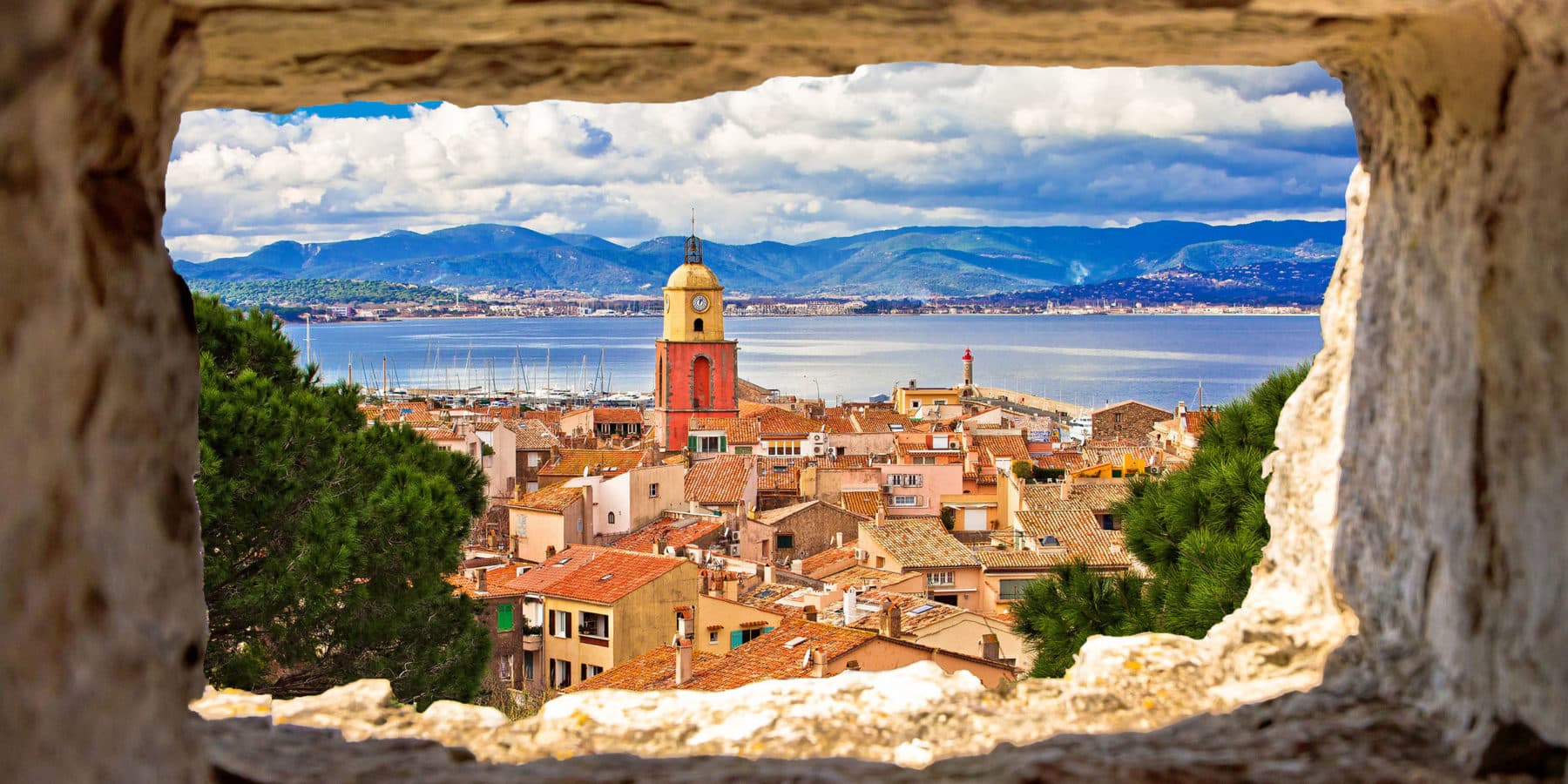 Saint Tropez village church tower and old rooftops view through